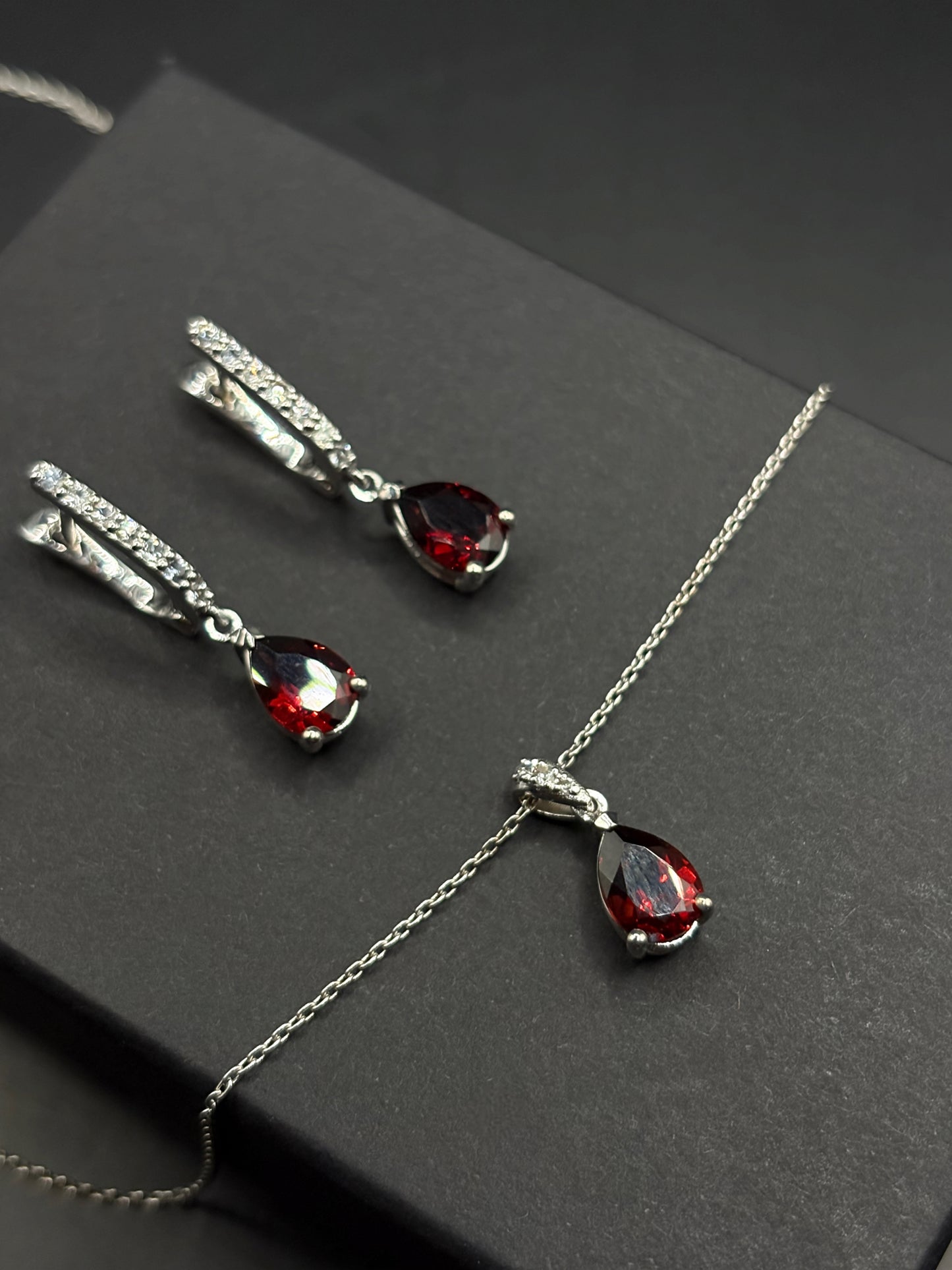 White Gold Set Featuring Red Pear Shaped Garnets & White Sapphire Entourage